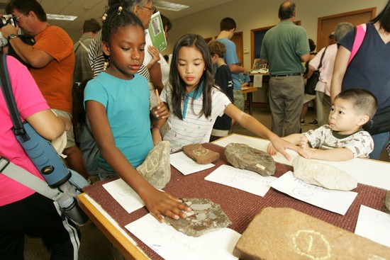 children in the rock touching room