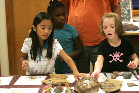 children in the rock touching room