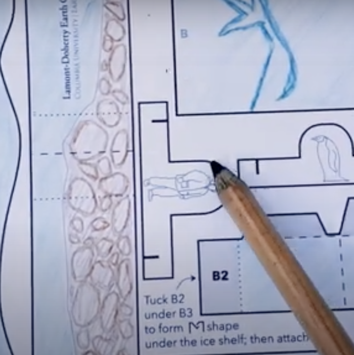 screenshot of paper craft video showing colored glacier drawing and pencil