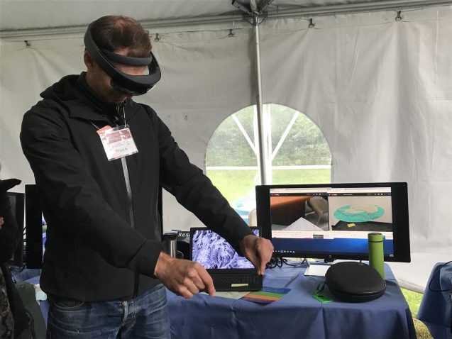 Assistant research professor Nicolas Young explores an Antarctic ice sheet in augmented reality. Photo: Sarah Fecht Nicolas Young tries augmented reality