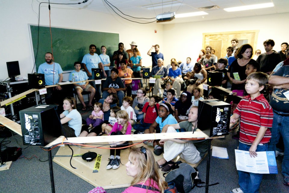 crowd listening to earthquakes in the seismic sound lab