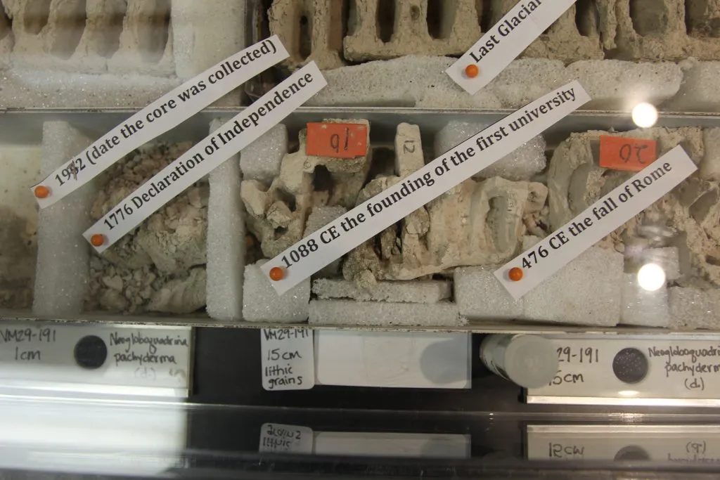 sediment cores labeled with their age and historic events occurring at the time