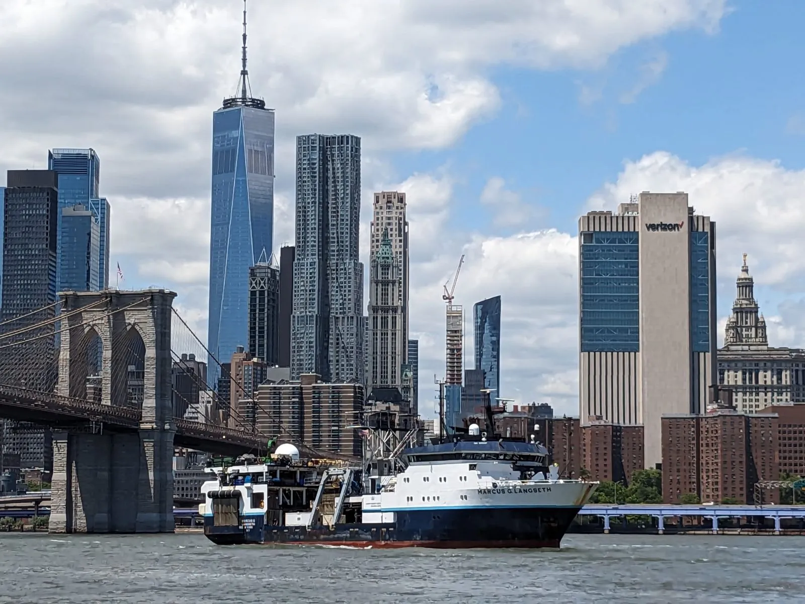 R/V Marcus G. Langseth in NYC's East River with the Brooklyn Bridge and lower Manhattan skyline in the background. Credit: Jesus Gaytan