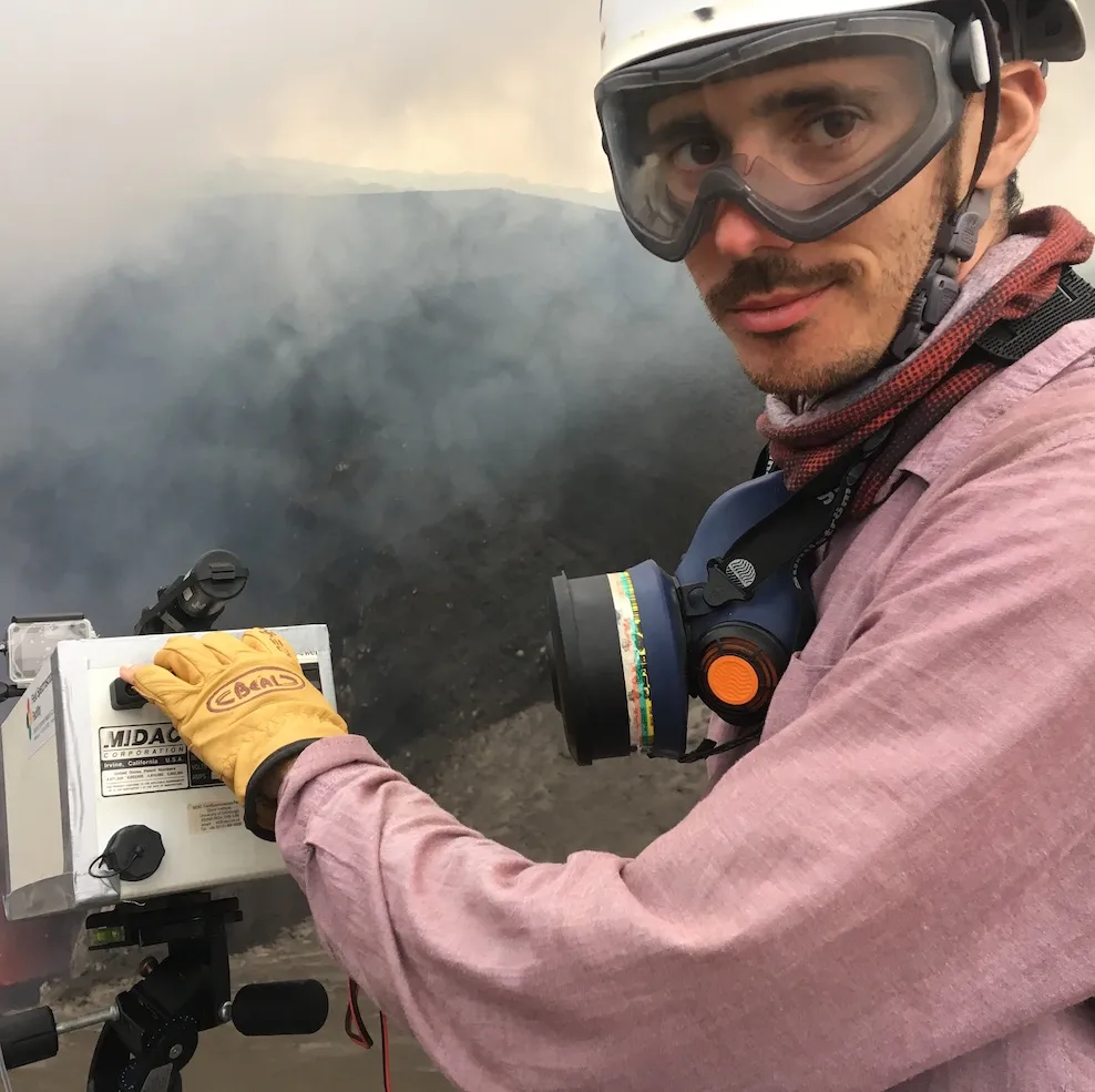 Photo of Yves with volcano